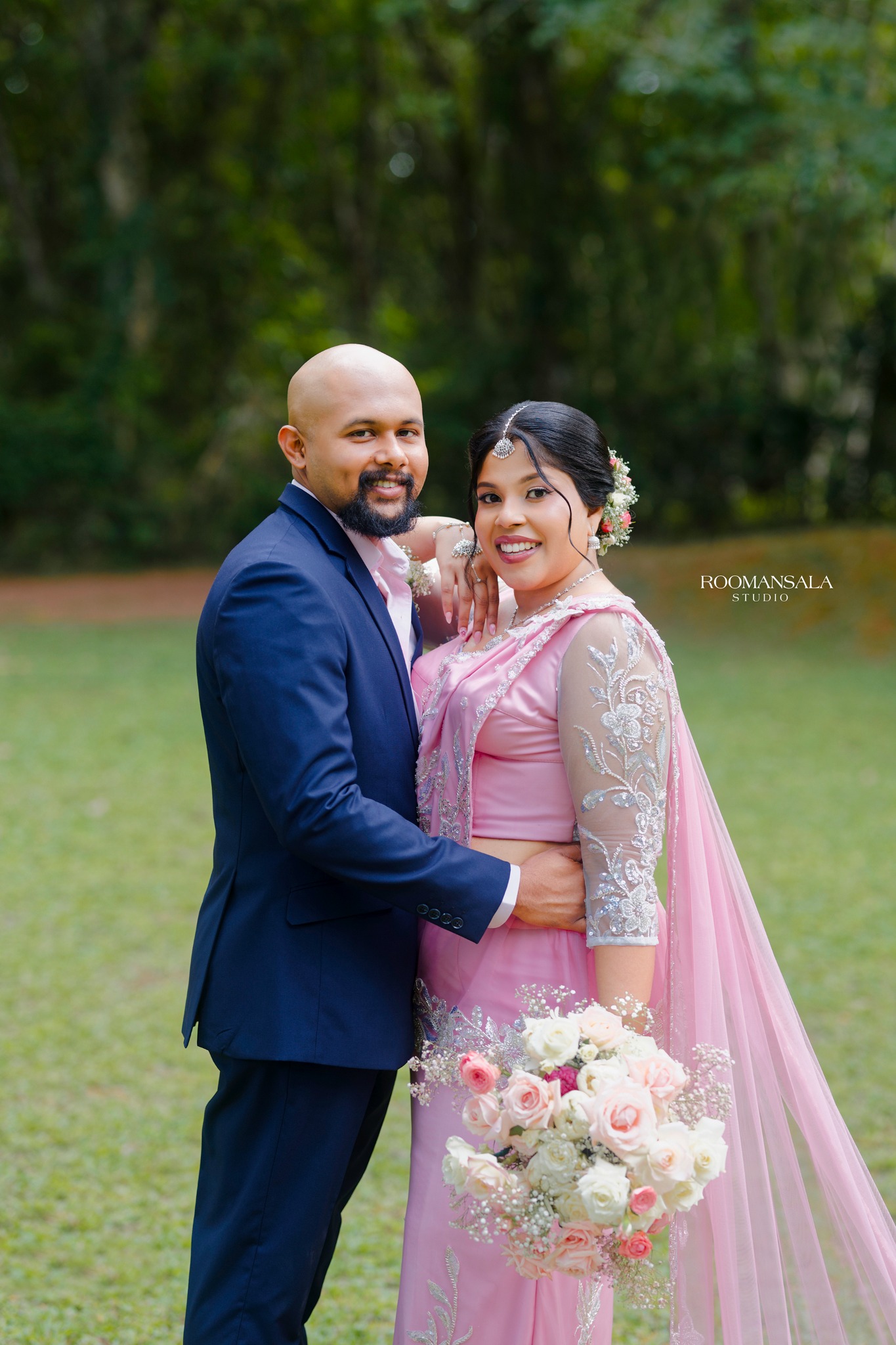 Terani and Eshan together in a forest setting